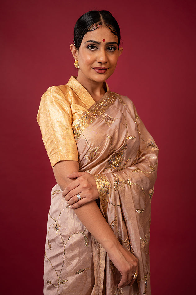 Soft peach pure tissue aari sequins jaal handwork saree