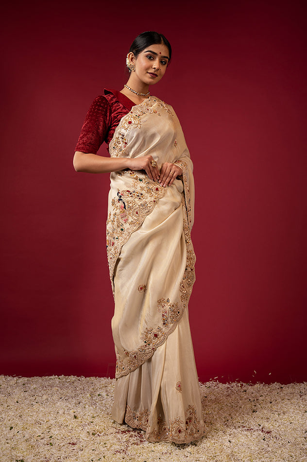 Cream pure tissue zardozi resham border butti handwork saree