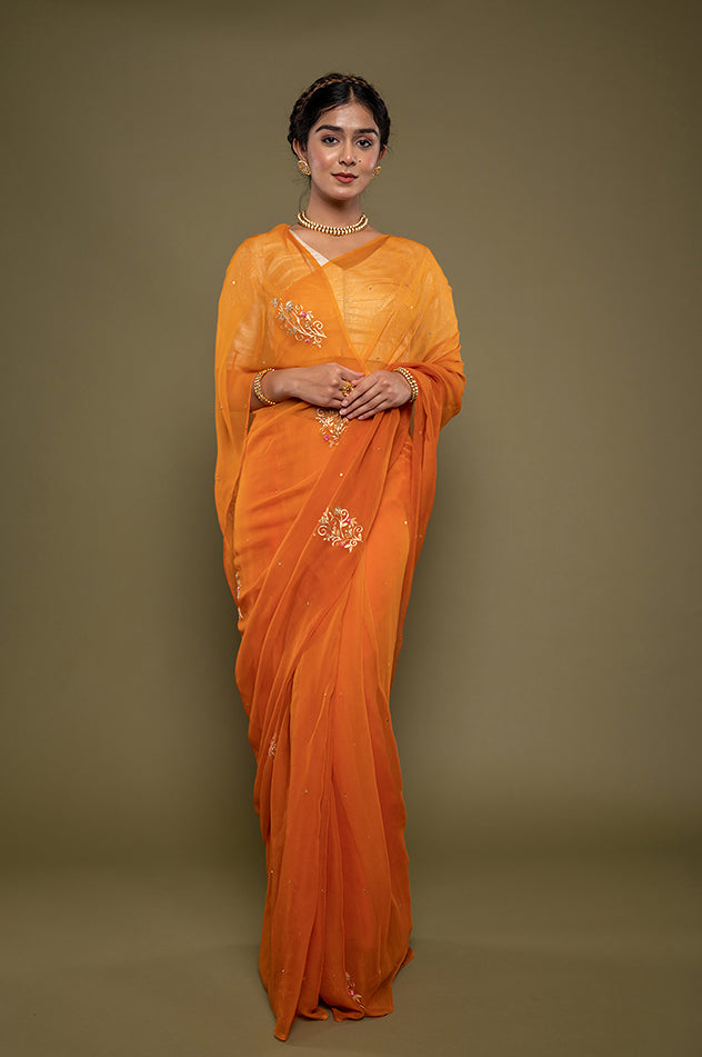 kesariya viscose chiffon aari sequins motif handwork saree