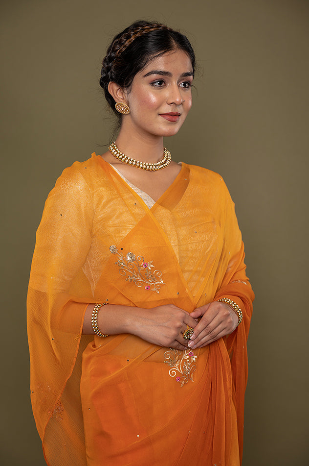kesariya viscose chiffon aari sequins motif handwork saree
