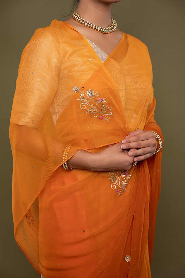 kesariya viscose chiffon aari sequins motif handwork saree