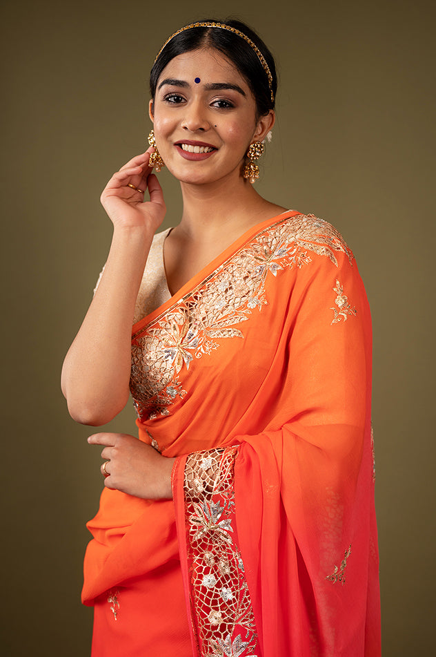 Orange light dark pure chiffon cut work border butti handwork saree